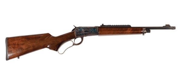 Lever-action rifle with a rich brown wooden stock and blued steel barrel, featuring a color case-hardened receiver.