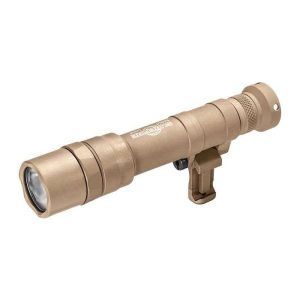 Tan tactical flashlight with a cylindrical design, featuring ridged grip details and mounted accessory attachment.