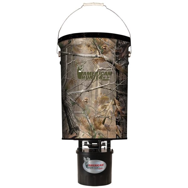 Camo-patterned deer feeder with the logo "american hunter" in green, featuring branches and leaves in brown and green hues.