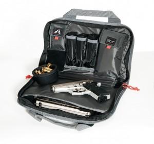Gray gun bag with open compartments displaying a silver handgun, black magazines, ammo rolls, and pouches, suitable for firearms storage; related to Iowa, Casey Iowa.