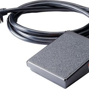 A black foot pedal with a textured surface, attached to a thick, coiled power cord ending in a standard plug.