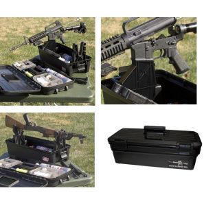 Black tactical range box with firearms and ammunition, displayed on a green outdoor table in Casey, Iowa.
