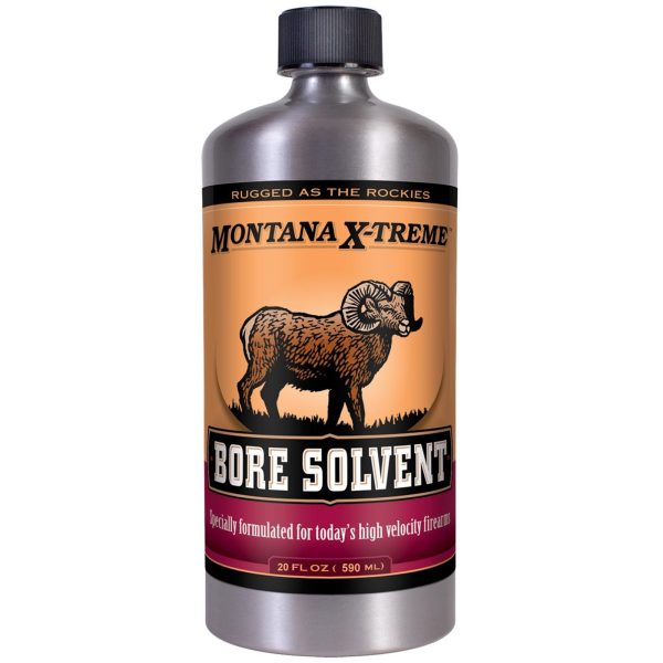 A bottle of montana x-treme bore solvent with an orange and black label featuring a ram illustration, highlighting rifle and firearm maintenance.