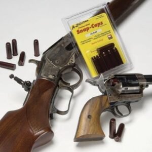 Brown wooden stock shotgun and revolver with wooden handle, surrounded by dark red snap caps; A-Zoom Snap-Caps packaging displayed, located in Casey, Iowa.