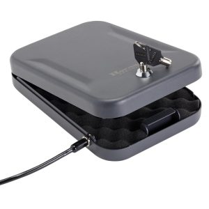 Gray firearm lock box with a key lock mechanism, foam interior padding, and a security cable.