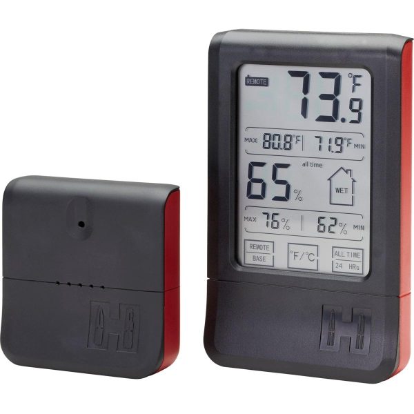 Digital hygrometer with black and red casing displaying temperature and humidity levels.