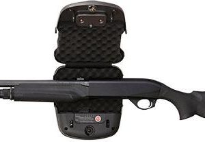 A black shotgun with a tactical stock laid over an open black padded gun case.