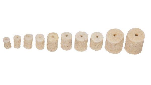 Cylindrical beige felt gun cleaning pellets in a row, varying in size.