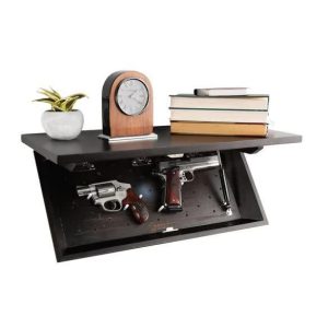 Black wall-mounted shelf with concealed compartment holding two handguns, a silver revolver, and a pistol with a wooden grip; top decorated with a small potted plant, a wooden clock, and stacked books.