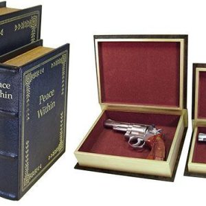Two faux book boxes with titles "Higher Power" and "Peace Within," open to reveal handguns with silver finishes and wooden grips inside red velvet-lined interiors.