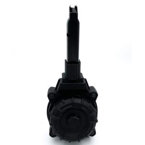 Black firearm magazine drum with a cylindrical shape and extended feed tower.