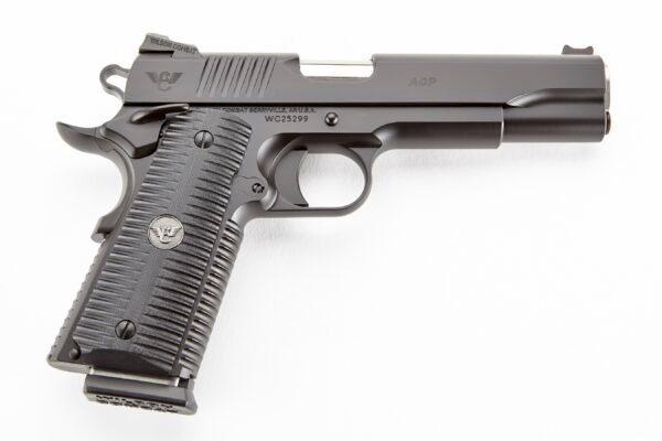 Black wilson combat acp handgun with textured grip, engraved logo, and visible serial number against a white background.