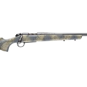 Rifle with a beige and black veined stock, silver metal parts, and a perforated muzzle brake.