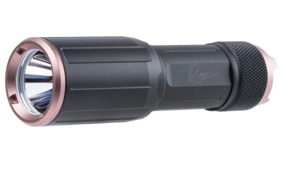 Compact black flashlight with copper accents and textured grip, angled view.
