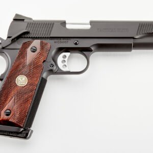 Black tactical pistol with silver trigger and dark wooden grip featuring detailed texturing and an emblem on the handle, set against a white background.