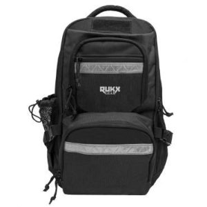 Black tactical backpack with gray accents, featuring multiple compartments, mesh side pocket, and branded "RUKX GEAR" logo.