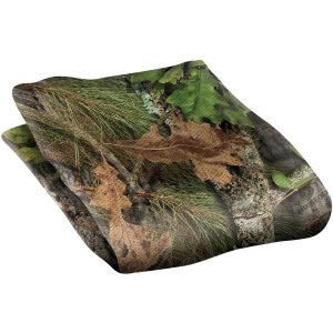 Camouflage hunting fabric with green, brown, and tan leaf and branch patterns.
