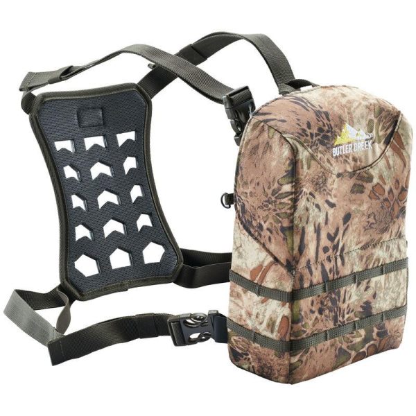 Camouflage-patterned backpack with dark green straps and back padding, labeled "butler creek. "