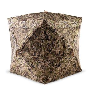 Camouflage hunting blind with green, brown, and black pattern, featuring angled windows and zippered access.