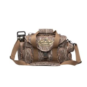 Camo-patterned waterproof bag with beige straps and multiple pockets, featuring "Rig'Em Right Waterfowl" logo, designed for firearms and ammo use, Casey Iowa.