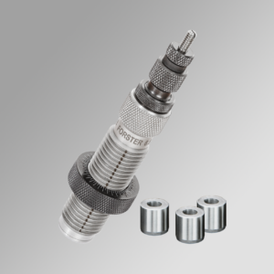 Polished silver reloading die with detailed knurled adjustments, accompanied by three cylindrical bushings on a gray gradient background.