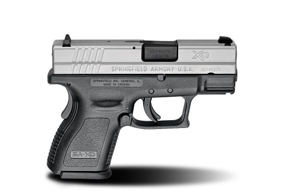 Black polymer grip and silver slide springfield armory xd firearm.