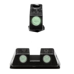Black firearm sights with glowing green tritium inserts for enhanced visibility.