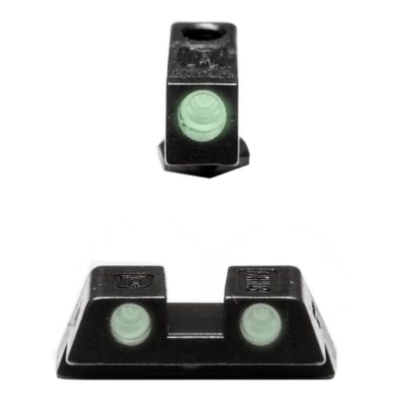 Black firearm sights with glowing green tritium inserts for enhanced visibility.