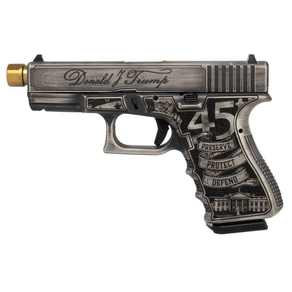 A custom gray and black handgun with gold details, featuring engraved text and american symbols on the grip.