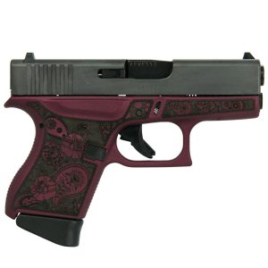 A purple and black handgun with intricate floral engravings on the grip.