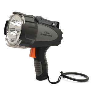 A gray and black hand-held spotlight with an orange trigger and a looped black cord, featuring the brand "Cyclops" on its side.