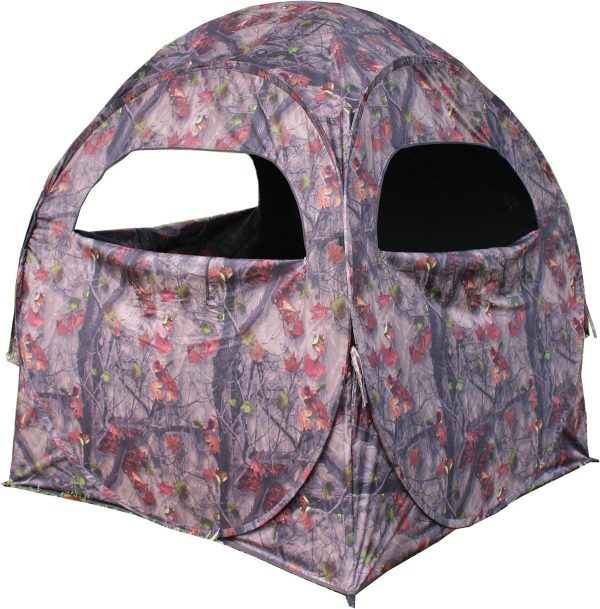 Camouflage hunting blind with a pattern of gray, brown, and red intertwined branches and leaves, featuring large rectangular openings.