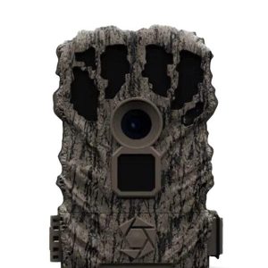 Camo-patterned trail camera with tree bark texture, featuring a central lens and rectangular sensor below it.
