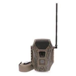 A brown camouflage trail camera with a long black antenna and a tan mounting strap.