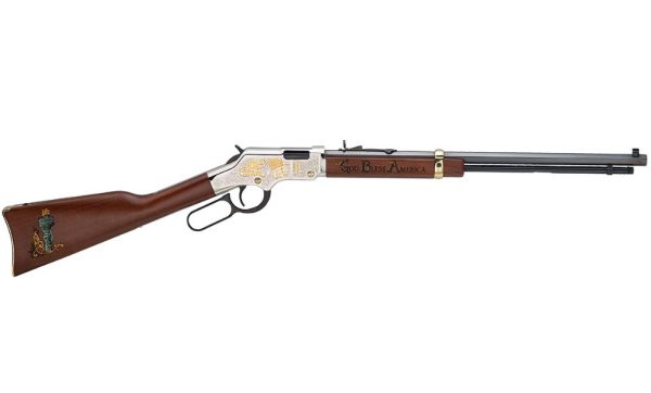 Lever-action rifle with a brown wooden stock featuring a green torch emblem, silver-toned metal parts with gold engravings, and "god bless america" inscribed on the side.