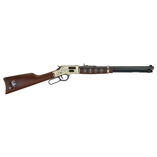 A detailed image of a lever-action rifle with a brass-plated receiver, dark wood stock, and engravings of military medals and a bald eagle.