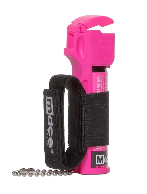 Bright pink mace pepper spray canister with black strap and keychain attachment.