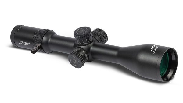 Black rifle scope with green-tinted objective lens, featuring precise adjustment knobs, suitable for firearms and guns.