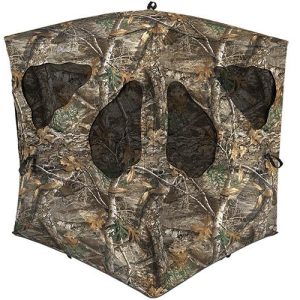 Camo hunting blind with leaf and bark pattern, featuring multiple window openings.