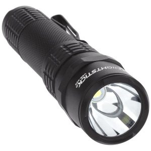 Black tactical flashlight with textured grip, featuring a clip and clear lens, designed for firearms and gear enthusiasts.