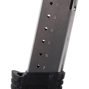 Silver gun magazine with seven numbered slots and a black base.