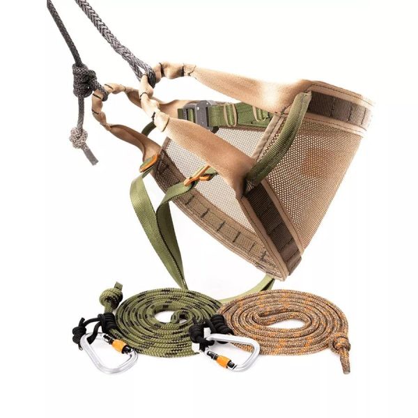 A tan and green outdoor harness with mesh paneling, accompanied by green and orange-brown climbing ropes with attached metal carabiners.