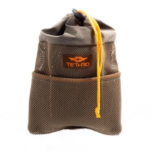 Olive green mesh drawstring bag with bright orange accents and a Tethrd logo, suitable for holding firearms or ammo; photographed against a white background.