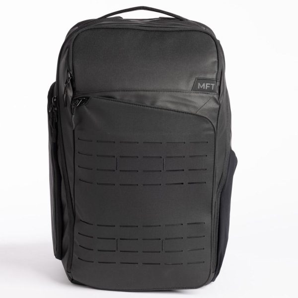 Dark gray tactical backpack with black detailing, featuring a patch with "mft" branding on the front.