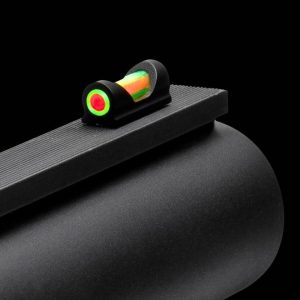 Close-up of a black firearm with a green and red fiber-optic sight on a black background.