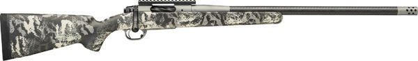 A bolt-action rifle with a camouflage pattern in black, gray, and beige colors, featuring a carbon fiber barrel and black perforated muzzle brake.