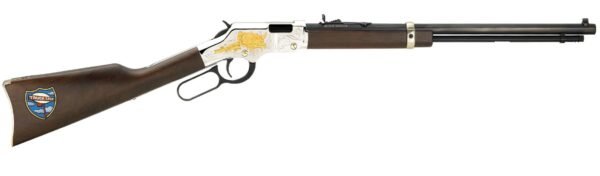 Vintage-style lever-action rifle with a dark wooden stock featuring a "truck stop" logo, engraved silver and gold receiver, long black barrel, and brass-colored accents.