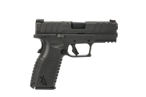 Black springfield armory xd-m pistol with textured grip shown in profile view.