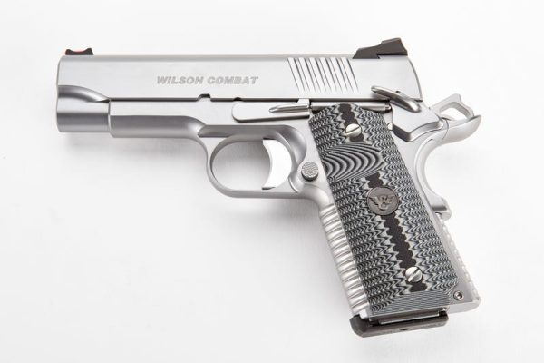 Silver wilson combat pistol with black and gray textured grip on a white background.
