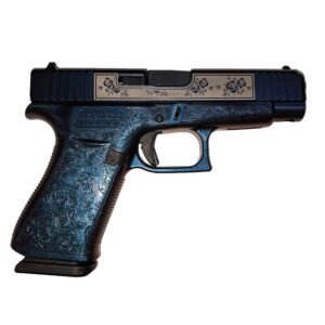 A detailed blue and silver engraved semi-automatic pistol, viewed from the side, showcasing its textured grip and design features.